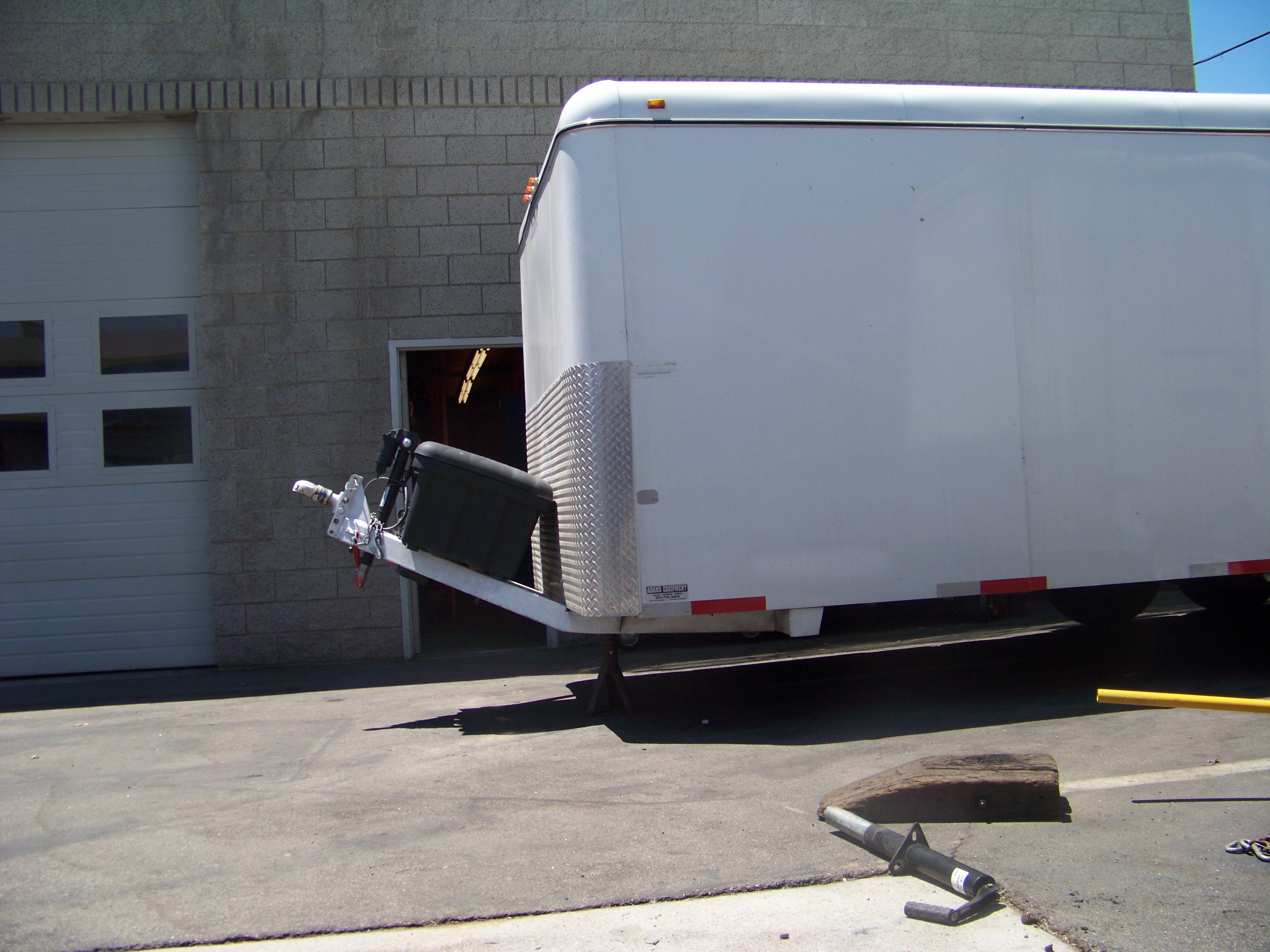 Eckharts technician repairing a severely bent trailer tongue using structural welding in Reseda, CA.