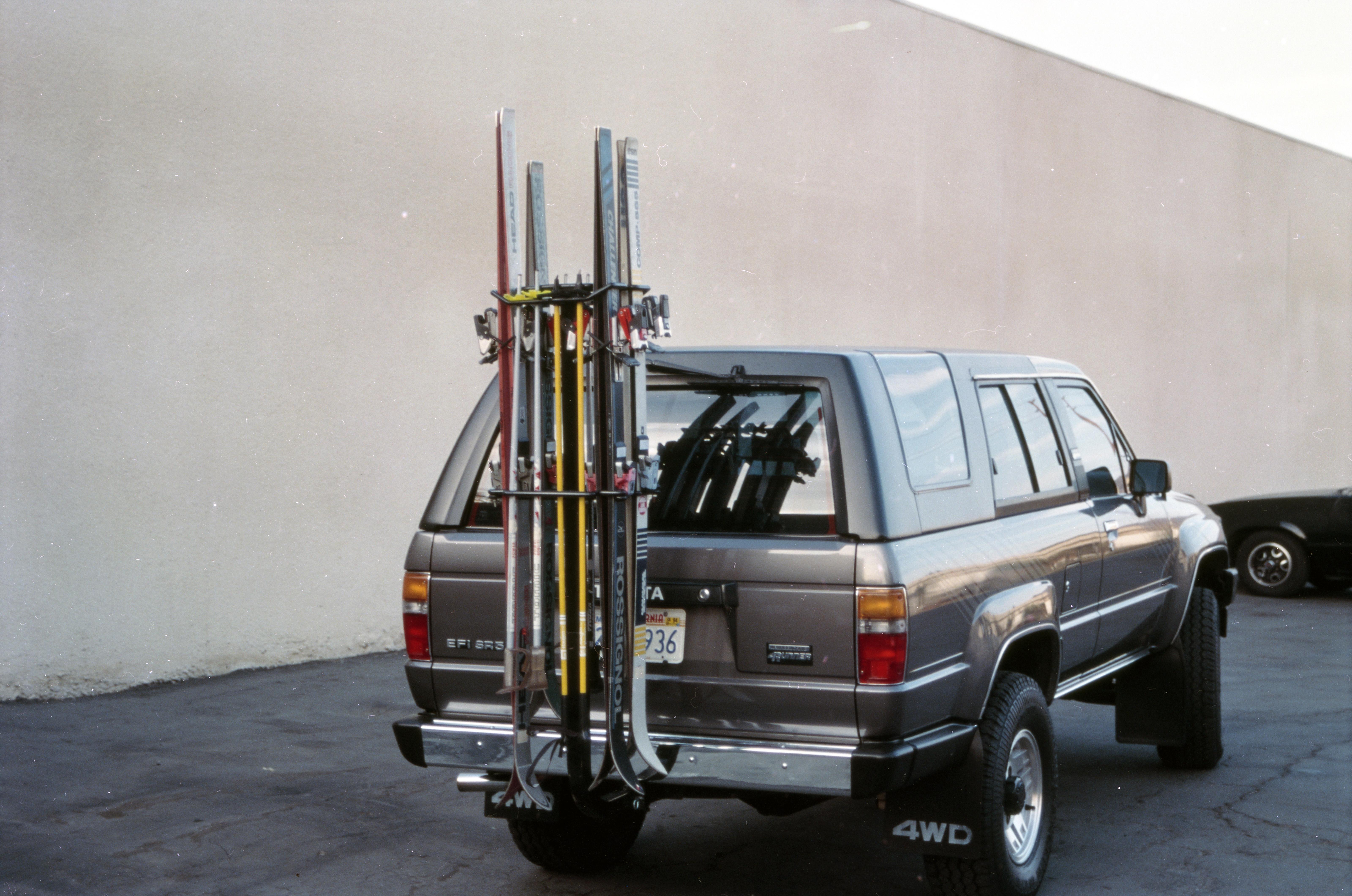 Custom hitch-mounted ski and snowboard rack with anti-wobble design.